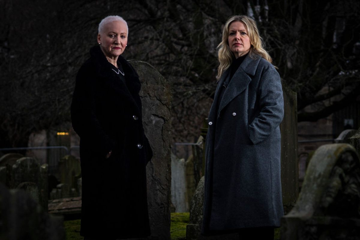 The founders of Witches of Scotland, Claire Mitchell and Zoe Venditozzi, in the Howff Cemetery in Dundee, Scotland. 