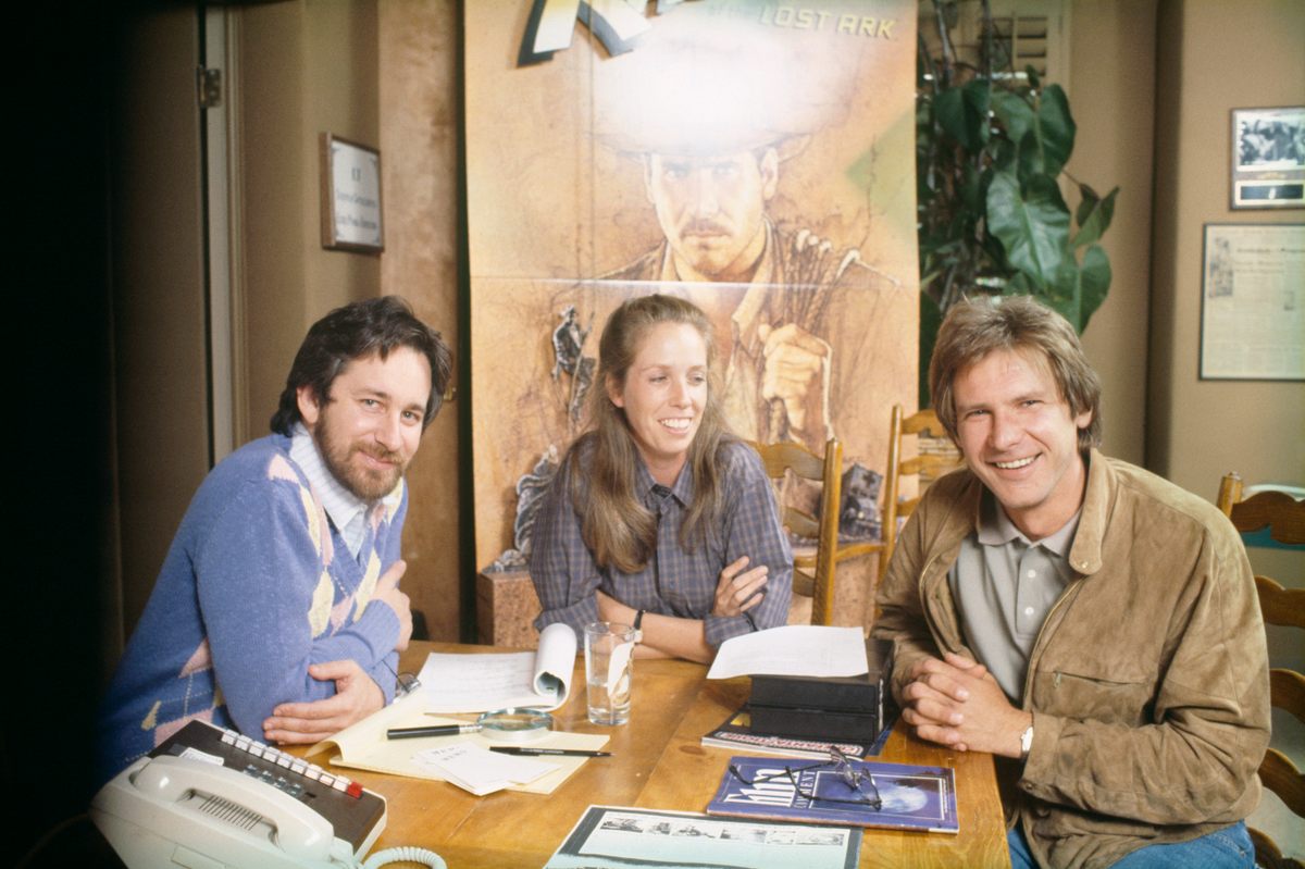 Steven Spielberg, screenwriter and producer Melissa Mathison, and her spouse at the time, actor Harrison Ford. 