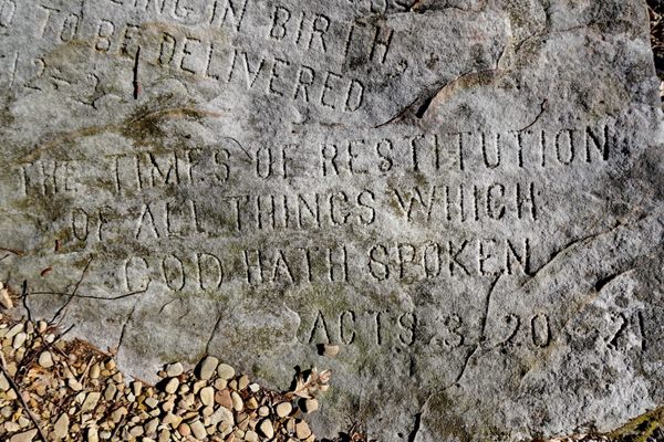 Scriptures engraved on the rocks.