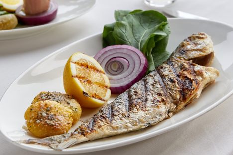 Charred local cipura (branzino) needs nothing more than a squeeze of lemon.