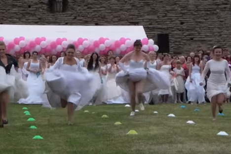 Watch Estonian Brides Race Each Other in Their Wedding Dresses 