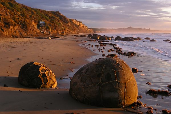 The Moeraki Boulders at sunrise. (Wikimedia Commons)