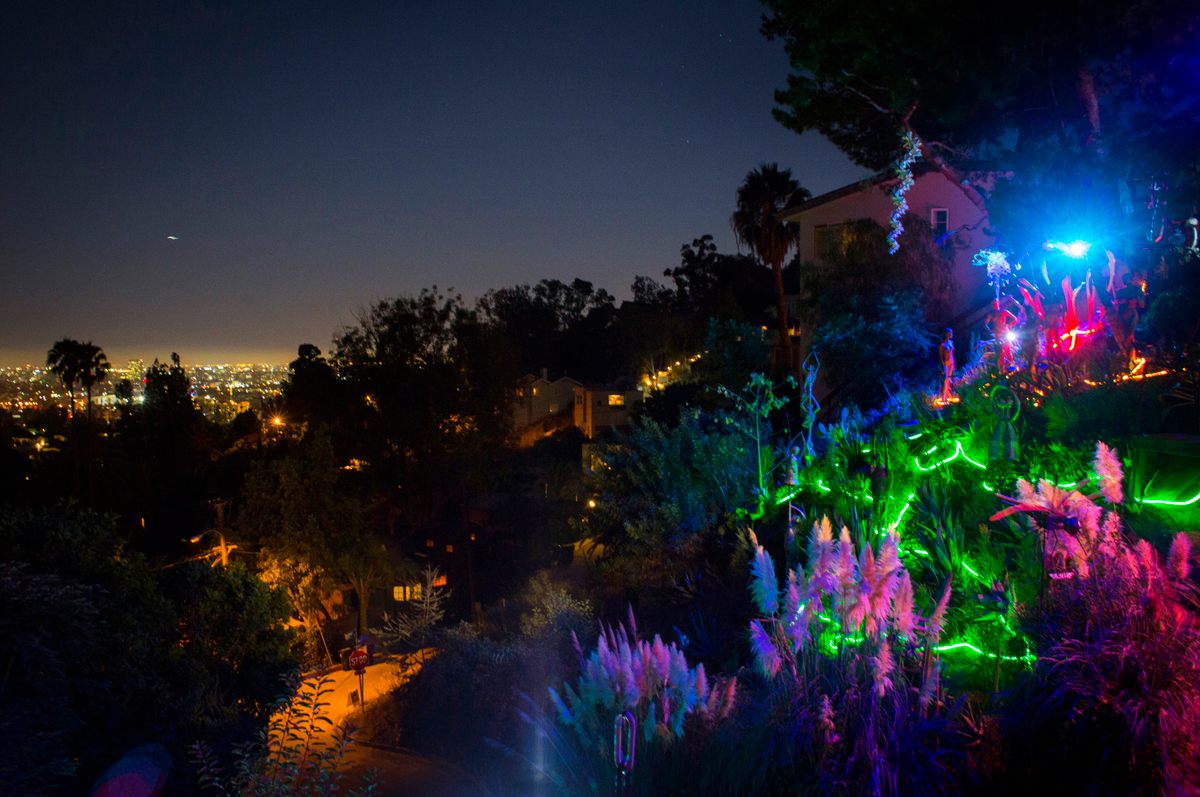 At night, the city and the garden play off one another: one a fanciful, dreamworld reflection of the other.