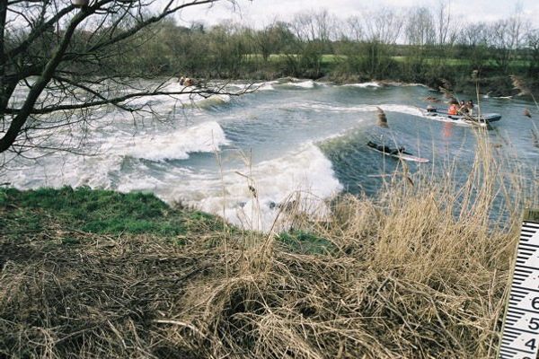 Surfers on the Severn bore