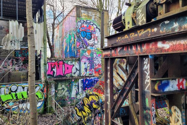 Graffiti on the exterior walls and the conveyor belt