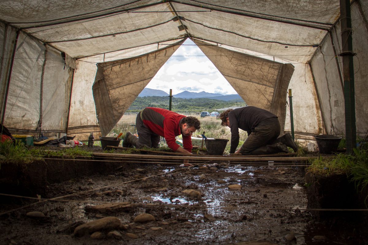 A tent protects the archaeology site at Estancia Moat from the vagaries of weather along the Beagle Channel/Onashaga—within the span of an hour, it could rain, hail, or even snow. Atilio Francisco Zangrando, left, coleads a team of archaeologists from the Centro Austral de Investigaciones Científicas del Consejo Nacional de Investigaciones Científicas y Técnicas (CADIC) in Ushuaia.