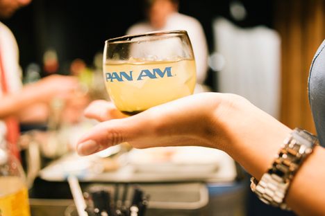 Enjoying the drinks service on board the Pan Am Experience. 