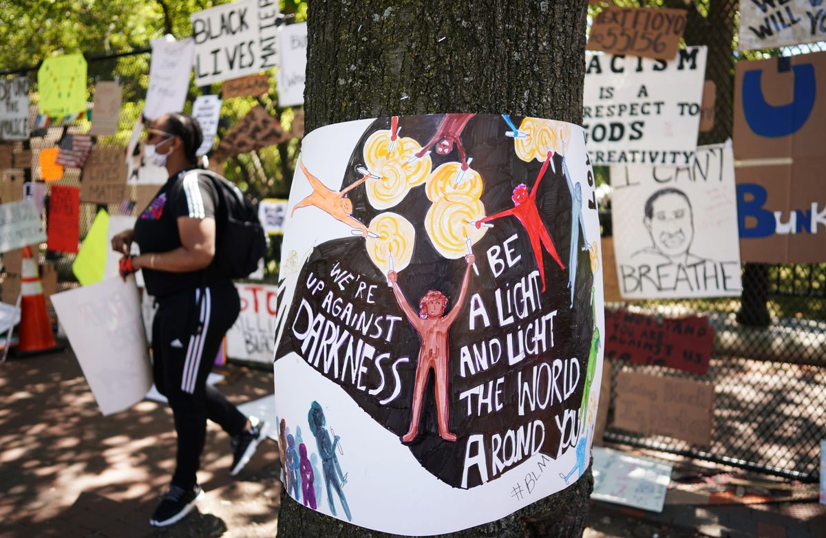 Protestors also affixed signs to trees on the north side of Lafayette Square.