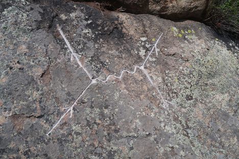Feynman Diagram rock carving.
