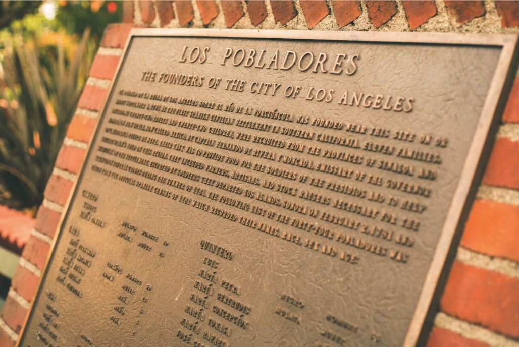 "Los Pobladores" plaque at El Pueblo de Los Angeles Historical Monument. 