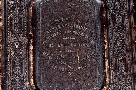 The front cover of the Bible, inscribed with the dedication to Lincoln.