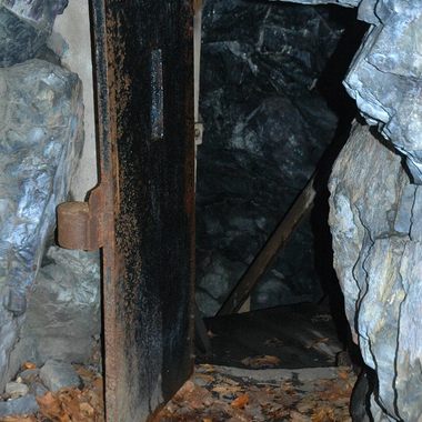 The iron door that currently marks the entrance to the cave