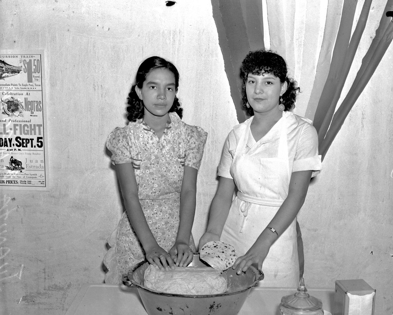 Juanita (left) and Esperanza Garcia make tortillas in this photograph from 1937.