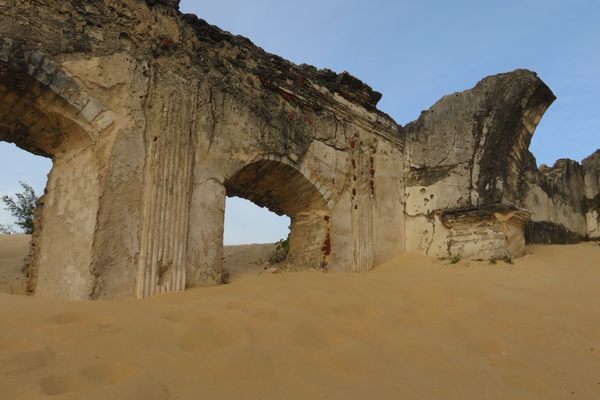 Walls of the old St. Anthony's church being eaten by sand dunes