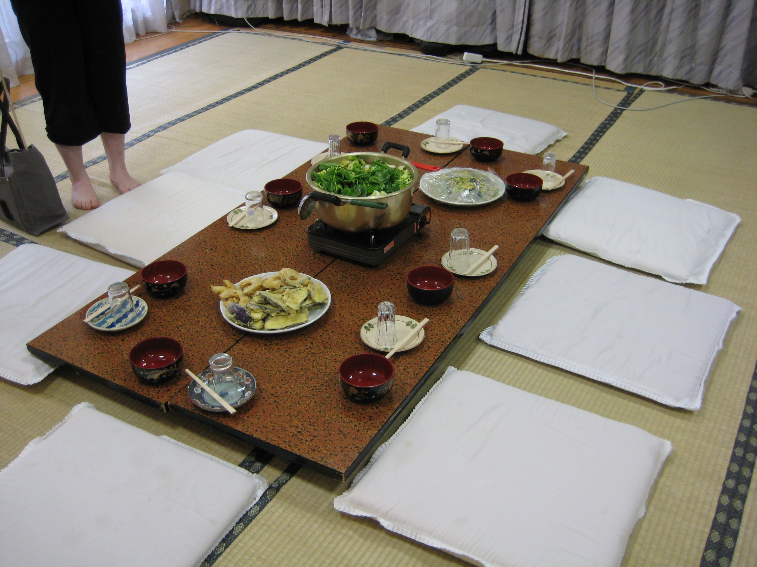 A commercial chanko set comes with pillows for diners to sit around the pot.  