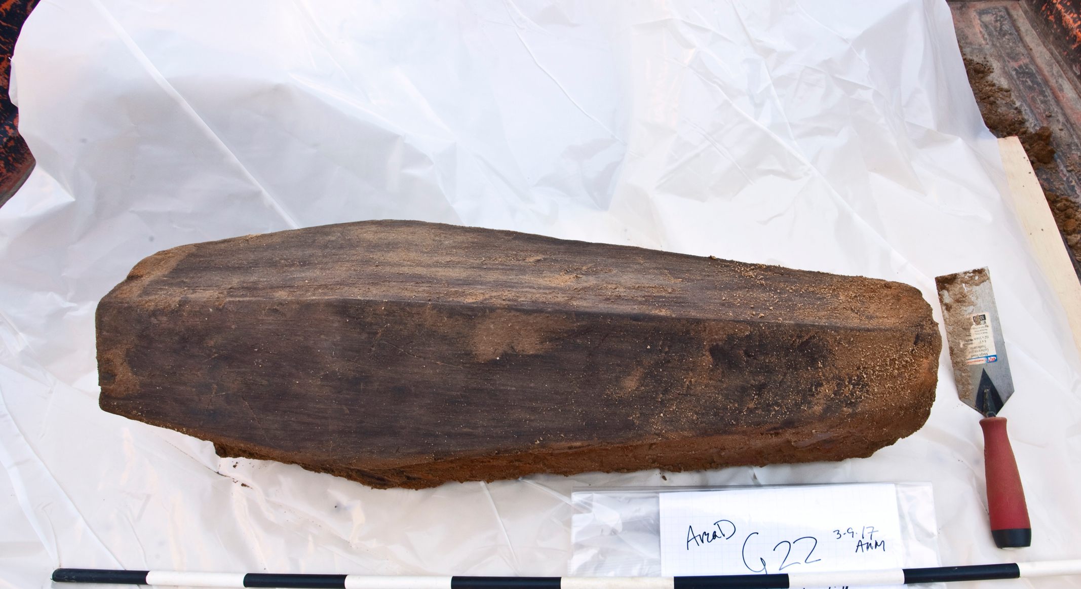 An exhumed coffin, ready for analysis.