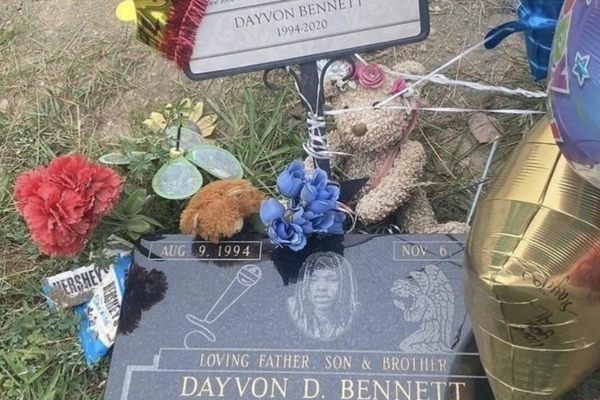 Balloons and stuffed animals from admirers cover King Von’s headstone.