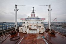 The deck of the SS United States, with a sign directing to the SS United States Conservancy's website.