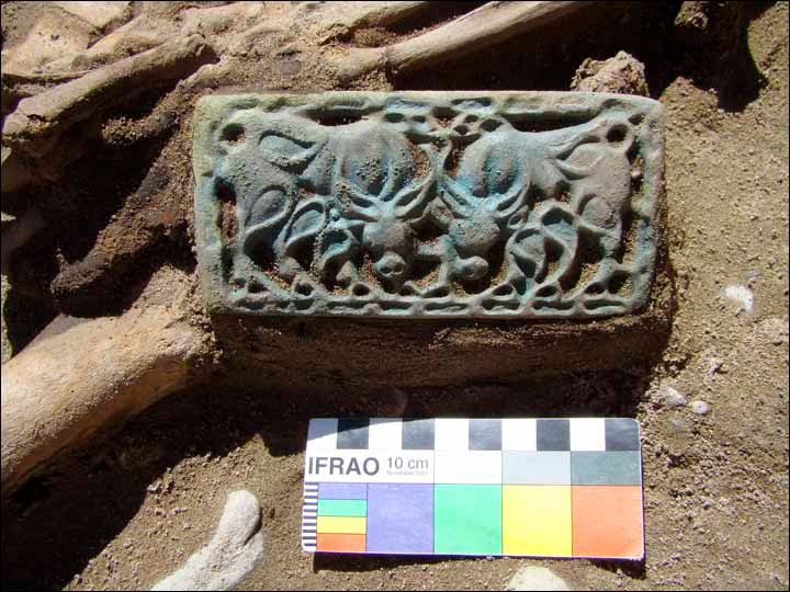 The bronze buckles have elaborate decorations.