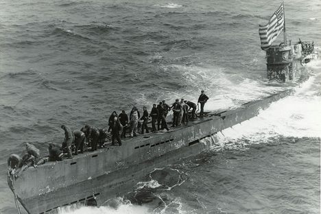 A U.S. Navy salvage crew works to save the captured German submarine U-505, shortly after she was abandoned by her German crew in June 1944.