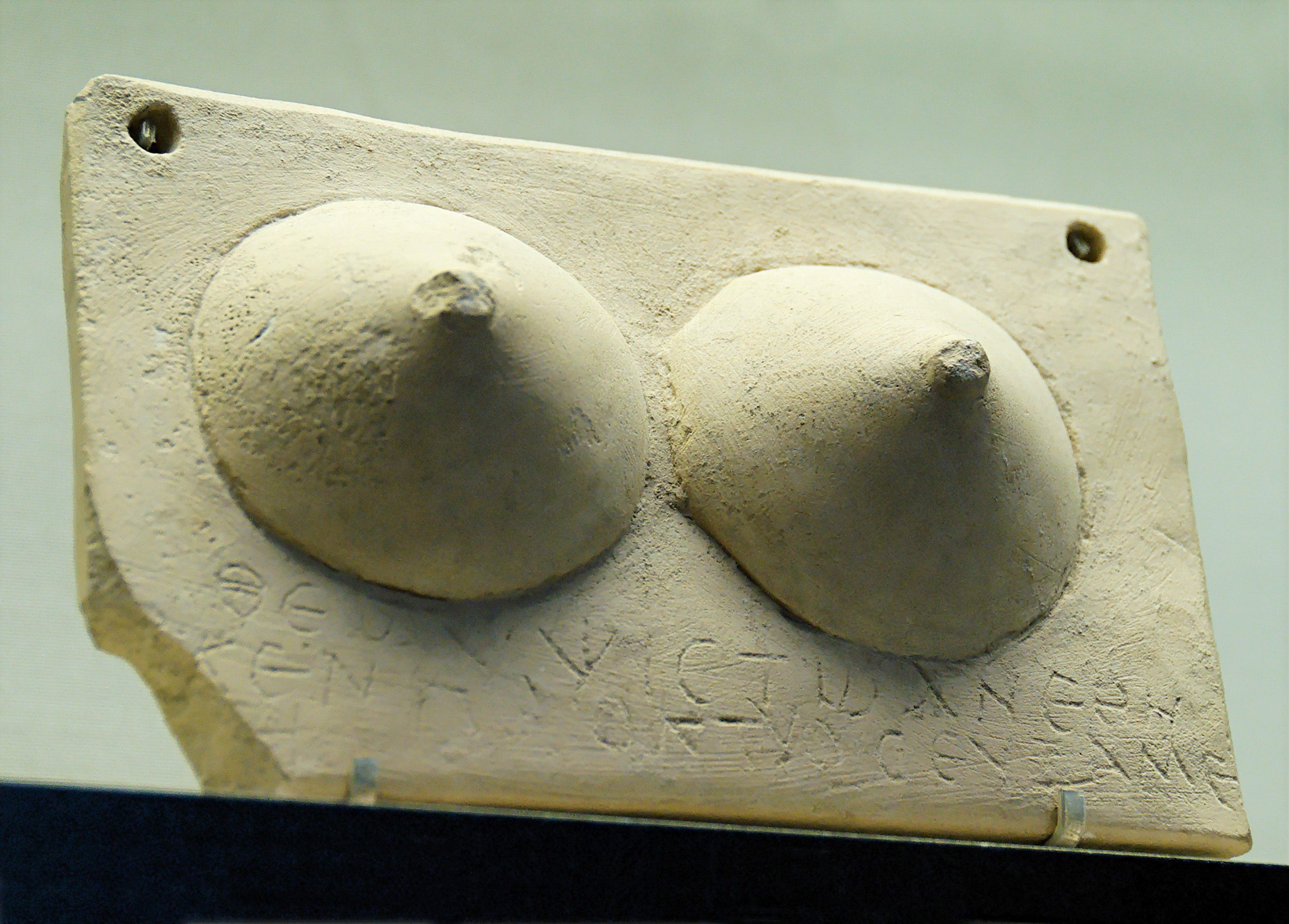 Votive plaque with breasts and a dedication to Zeus Hypsistos.