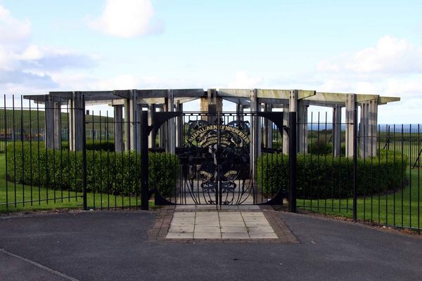The NUM memorial  garden with the cage high on the hill on the left hand side