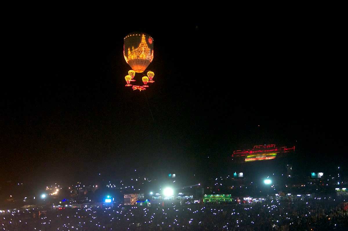 A balloon featuring a design featuring the famed temples of Bagan floats into the sky.