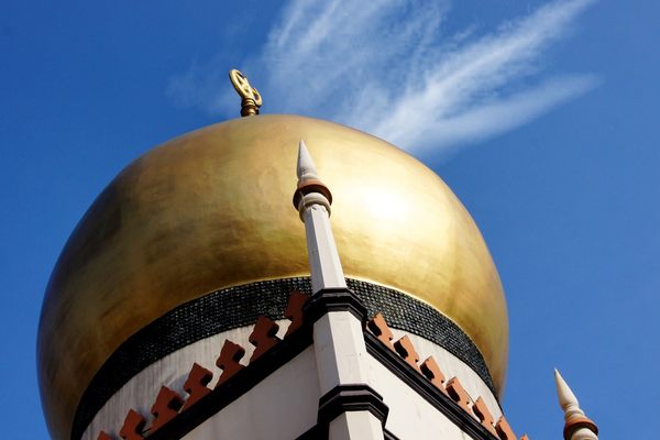A dome of Sultan Mosque, with the ring of bottle bases visible at the bottom.