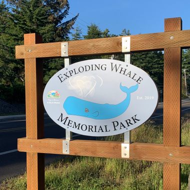 The whale on the sign forms a heart with its spout