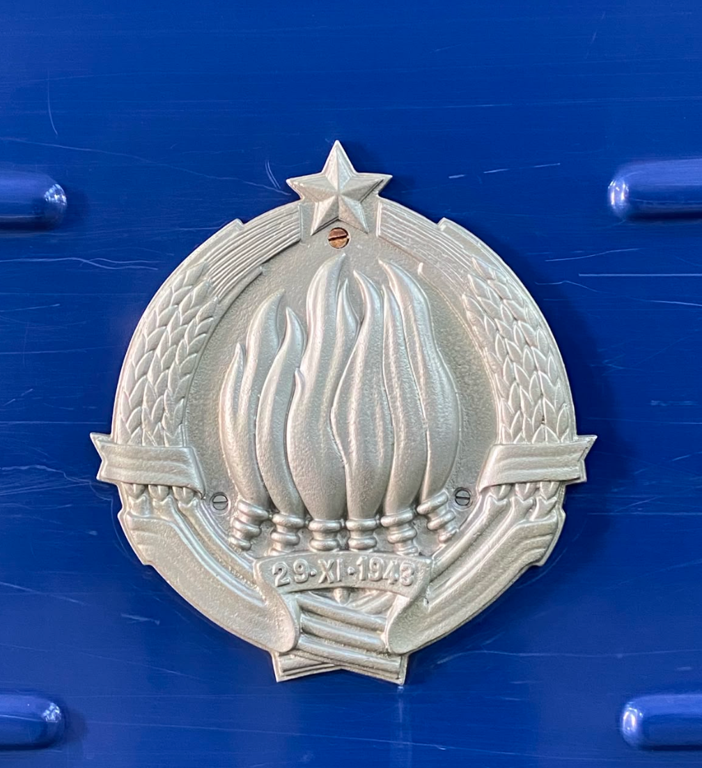 A crest of Yugoslavia on the blue train