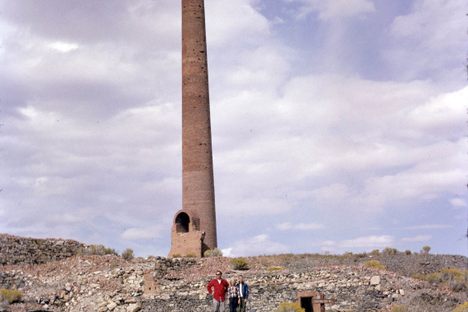 The Consolidated Mill chimney in 1965.  Figures give scale.