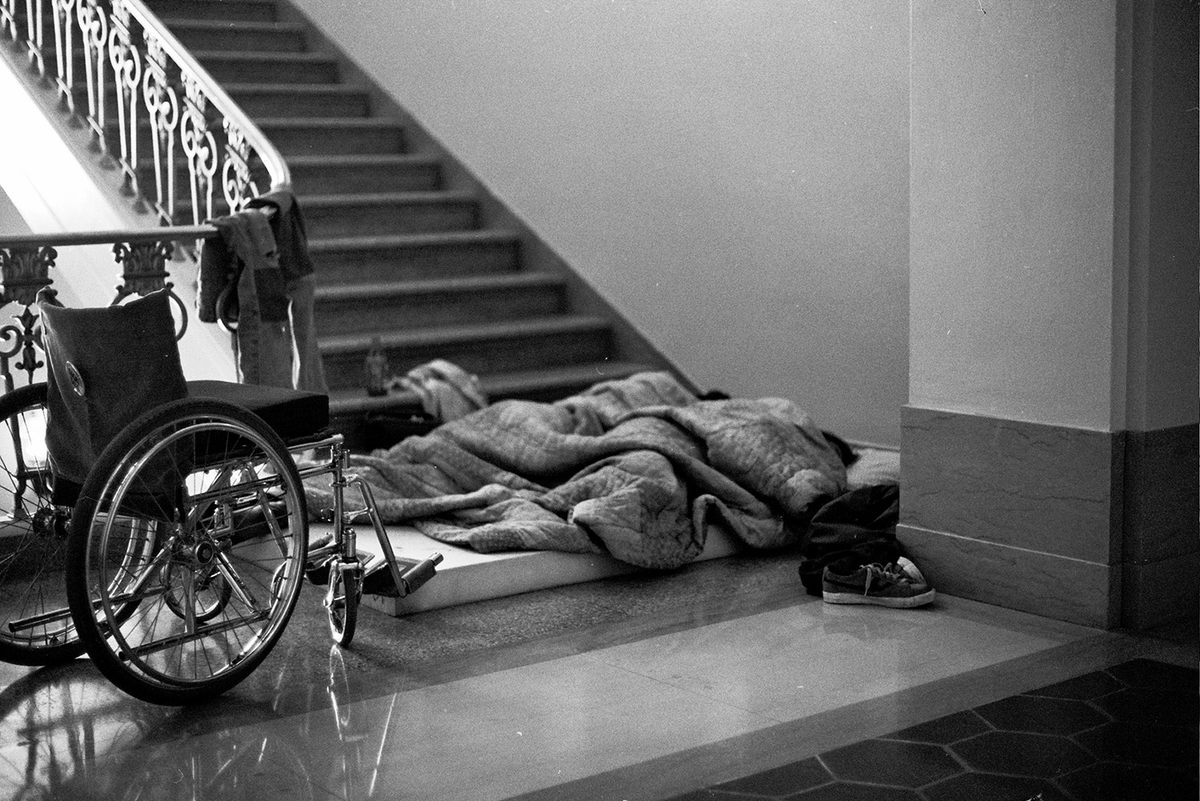 Two protesters sleep on a mattress in a stairwell. D'Lil notes that mattresses arrived about two weeks into the protest.