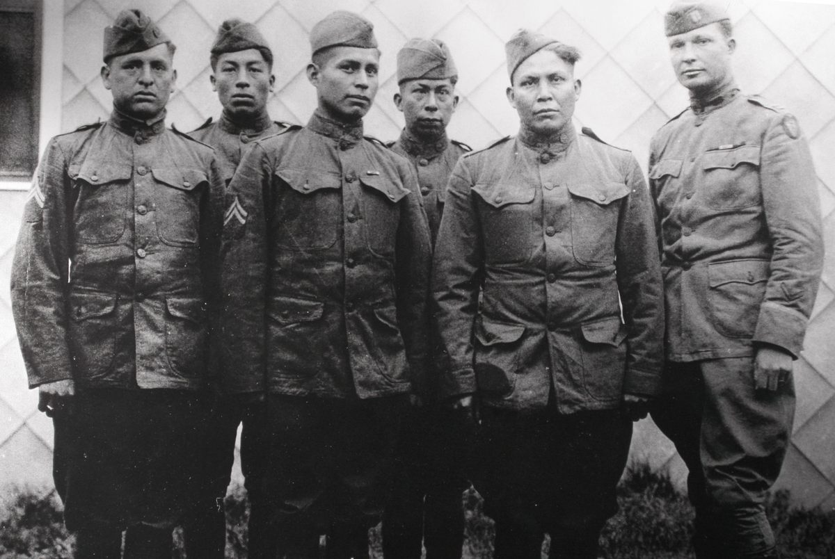 The World War I Choctaw Telephone Squad, 142nd Infantry, 36th Division, Company E (left to right): Solomon Lewis, Mitchell Bobb, James Edwards, Calvin Wilson, Joseph Davenport, and Captain E.H. Horner. 