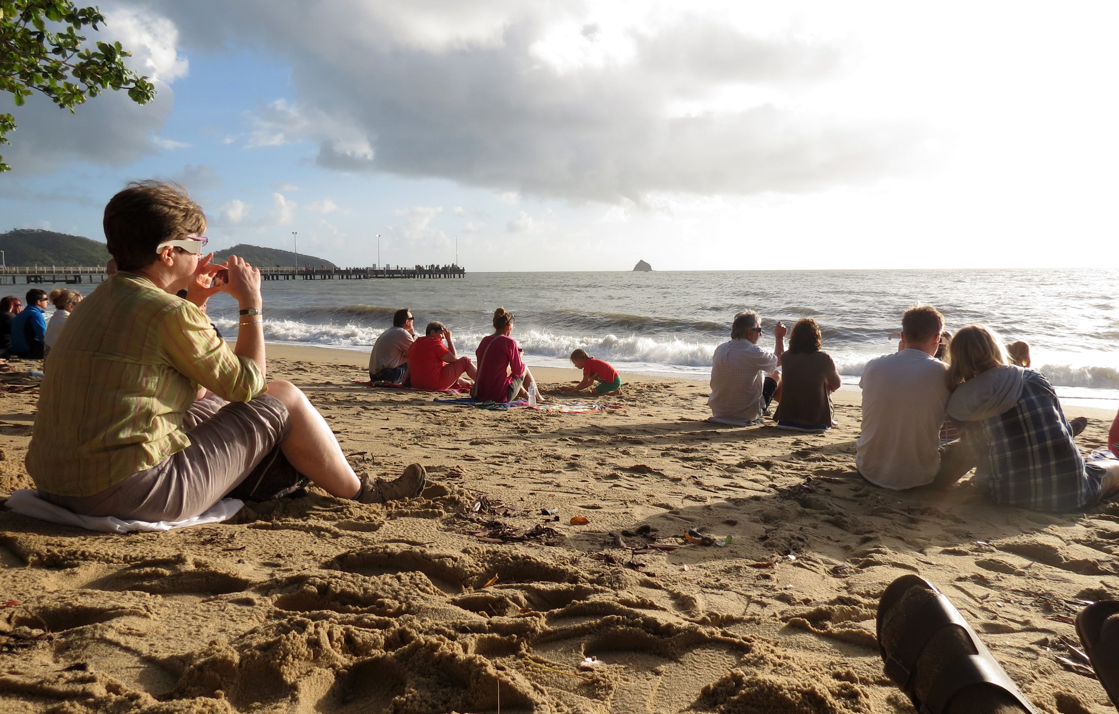 People gather on a beach in Australia to watch the 2012 eclipse. 