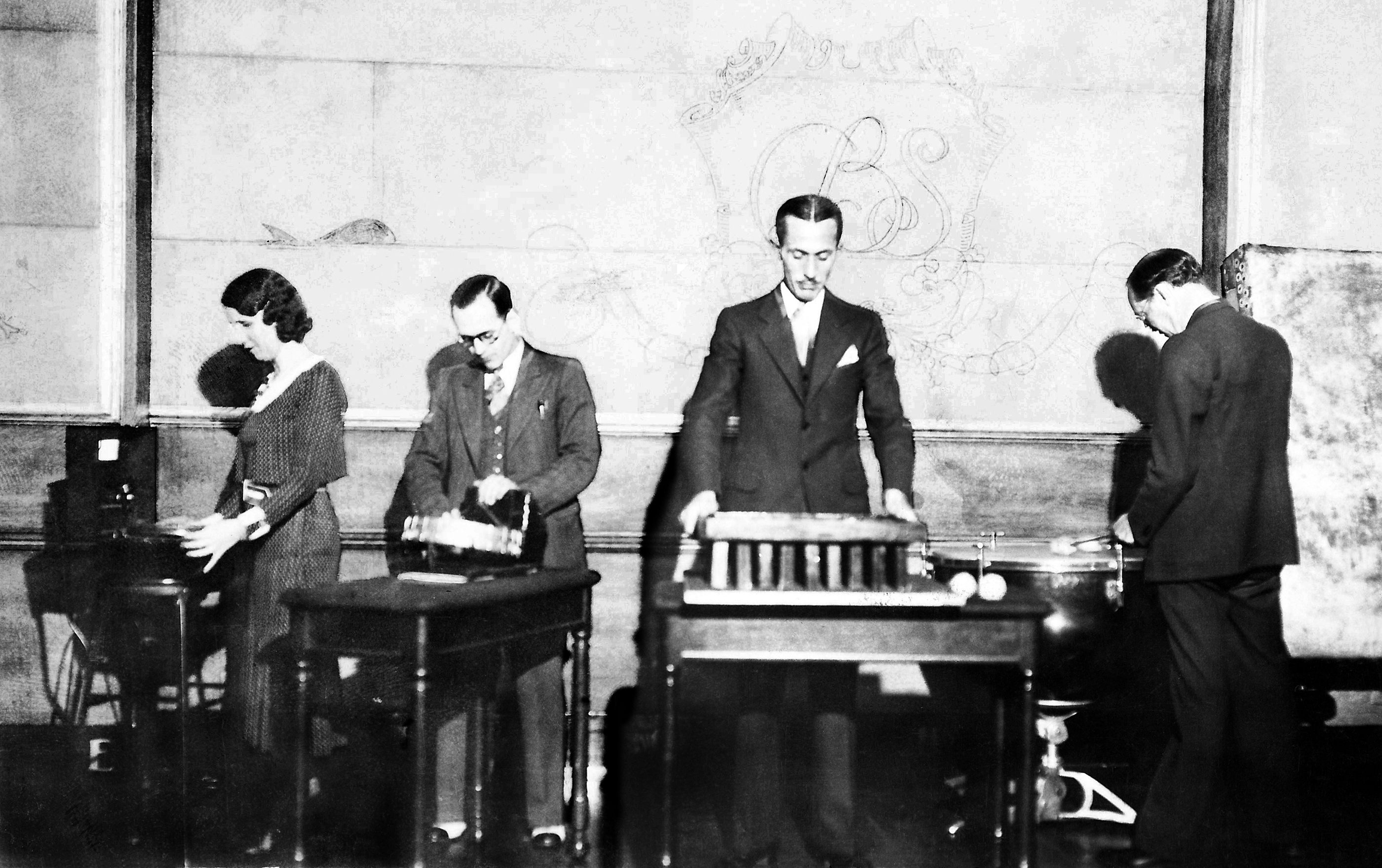 A 1931 photo depicts the sound effects team for a radio series on <em>CBS</em> called The March of Time.