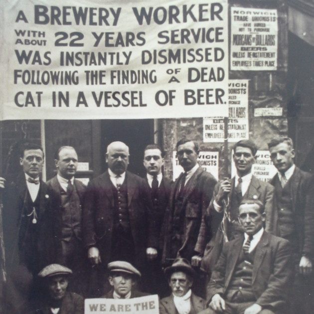 Striking brewery workers protesting the unfair firing of a coworker. 