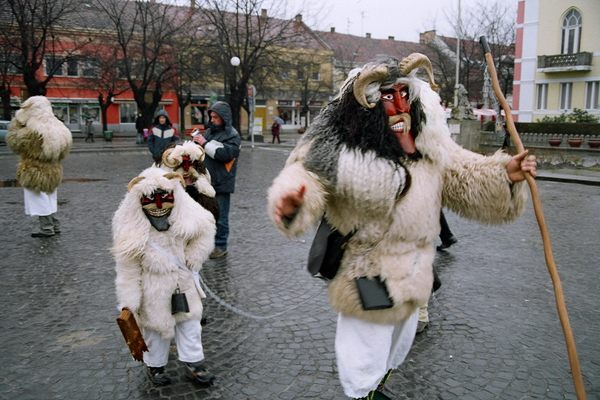 A monster with two smaller monsters in tow.
