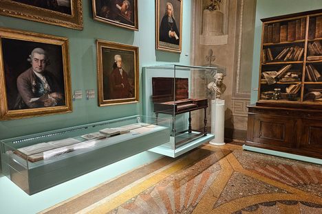 A room featuring some of the paintings belonging to Father Martini, including portraits of J. C. Bach and Mozart (both in the lower row of portraits).