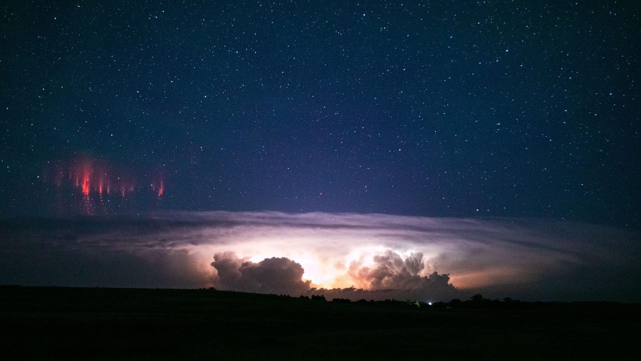 When red sprites, pictured here above Nebraska, are accompanied by a diffuse, dome-shaped glow, it can look like a jellyfish is hovering in the sky.