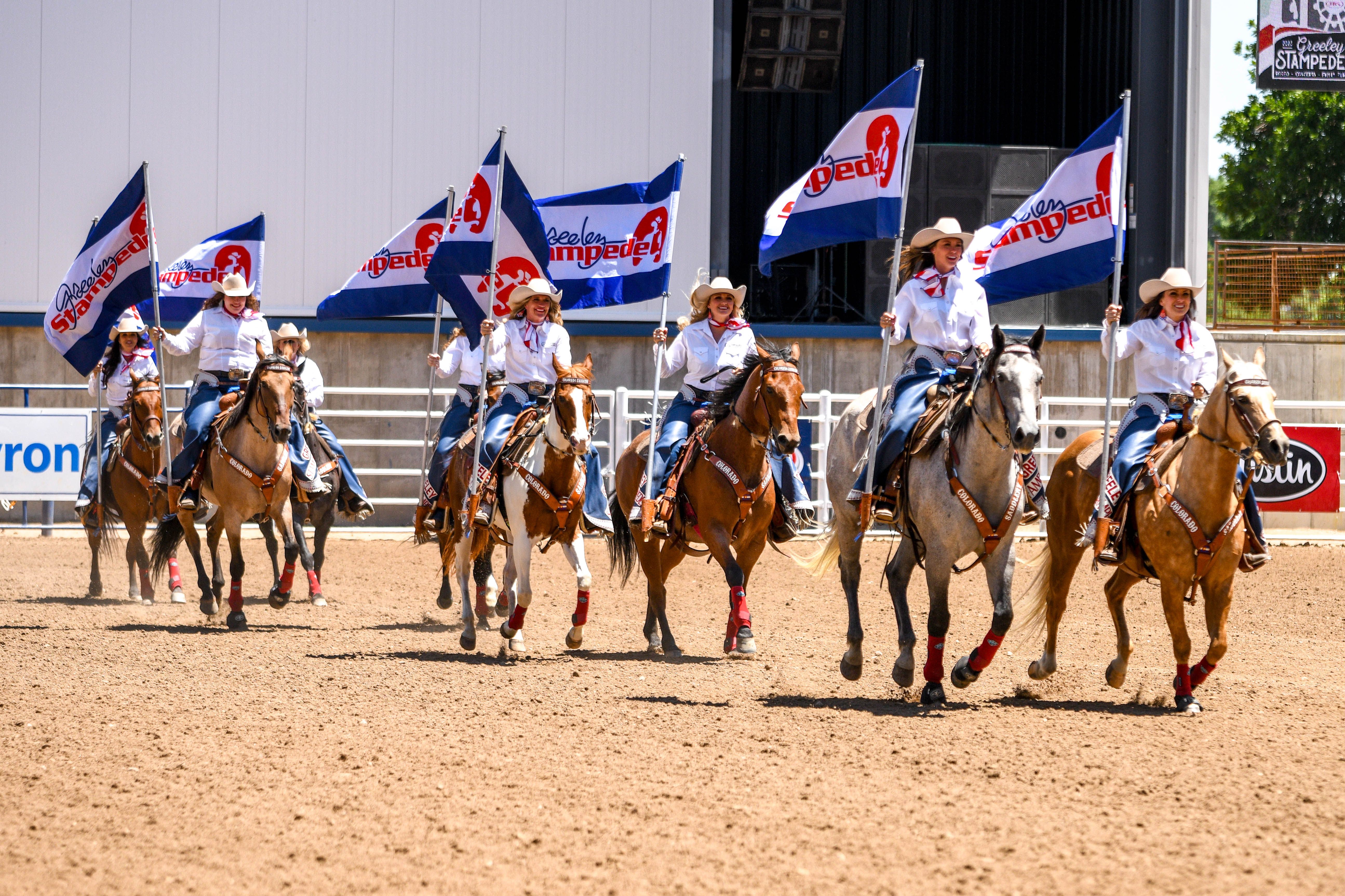 Riders line up during the Greeley Stampede.