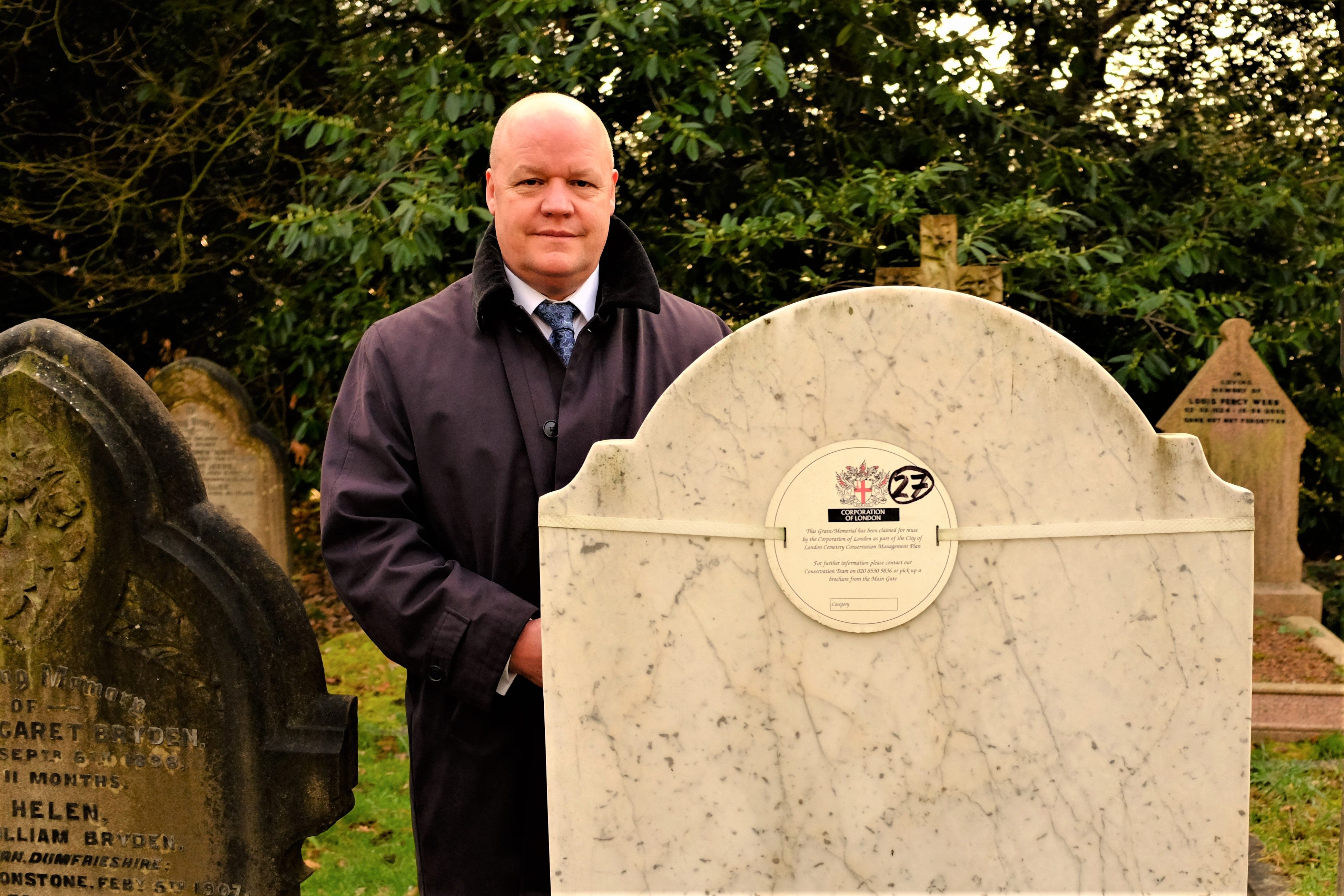 Gary Burks, superintendent of City of London Cemetery, stands with a grave slated to be reused.