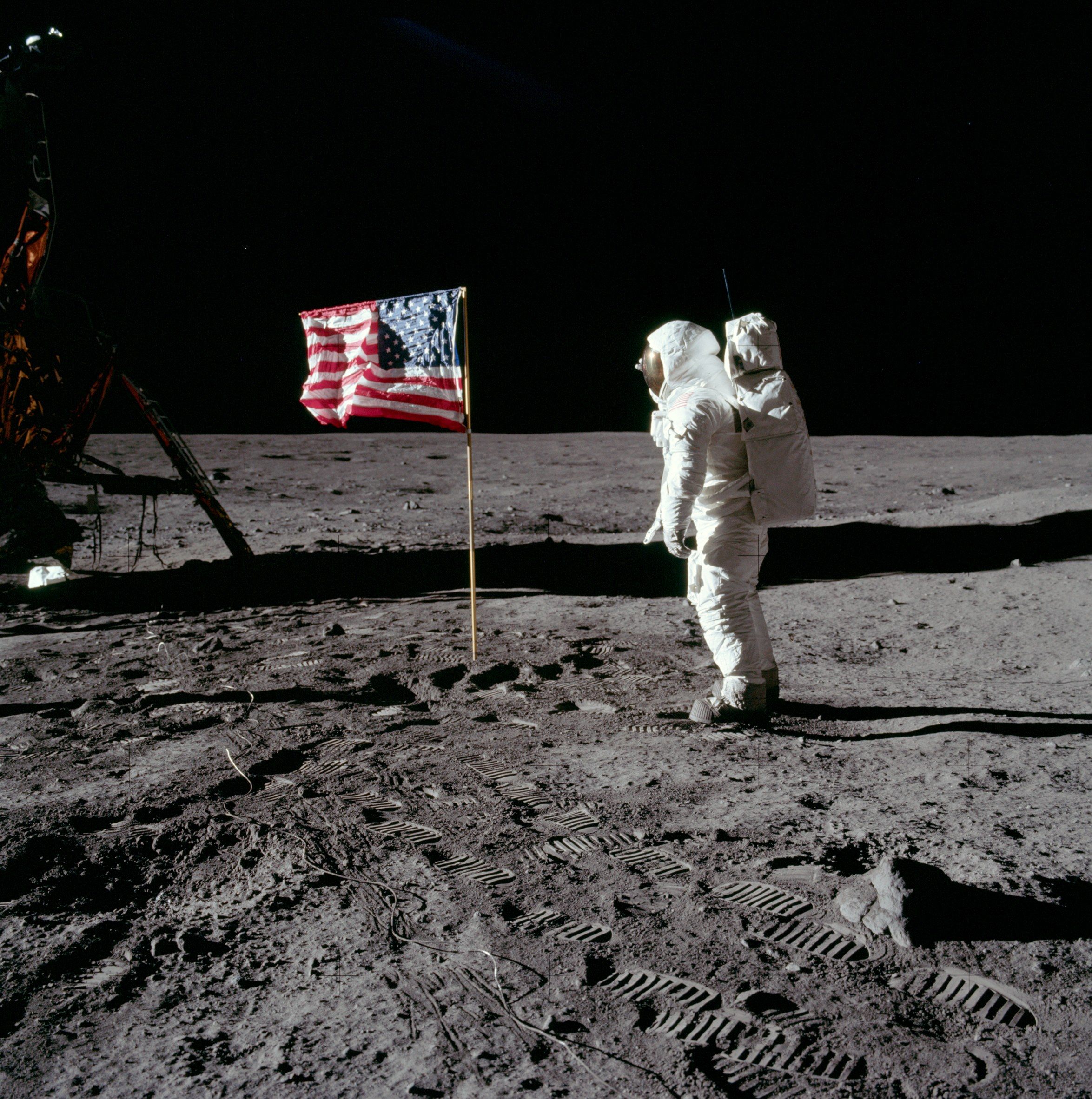 Buzz salutes the American Flag in 1969.