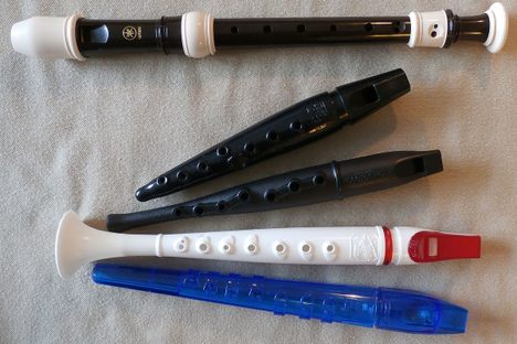 Some of the world of classroom wind instruments. From top to bottom: Yamaha soprano recorder, Swanson Tonette, Conn-Selmer Song Flute, Grover-Trophy Flutophone, Suzuki Precorder.