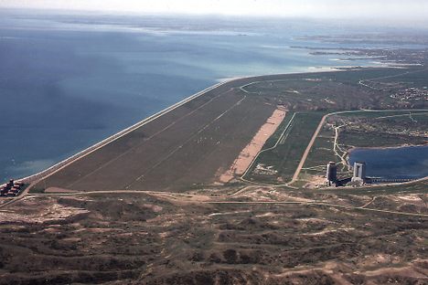 Aerial view of Fort Peck Dam, showing both powerhouses and dam. Missouri River, Fort Peck, Montana