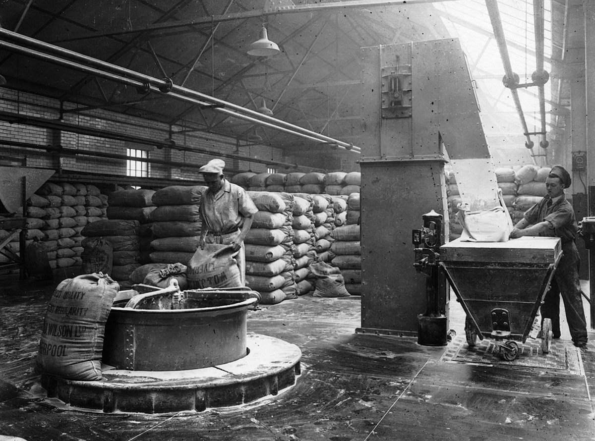 Employees work in one of the flour-blending plants for a biscuit factory in Liverpool in 1926.