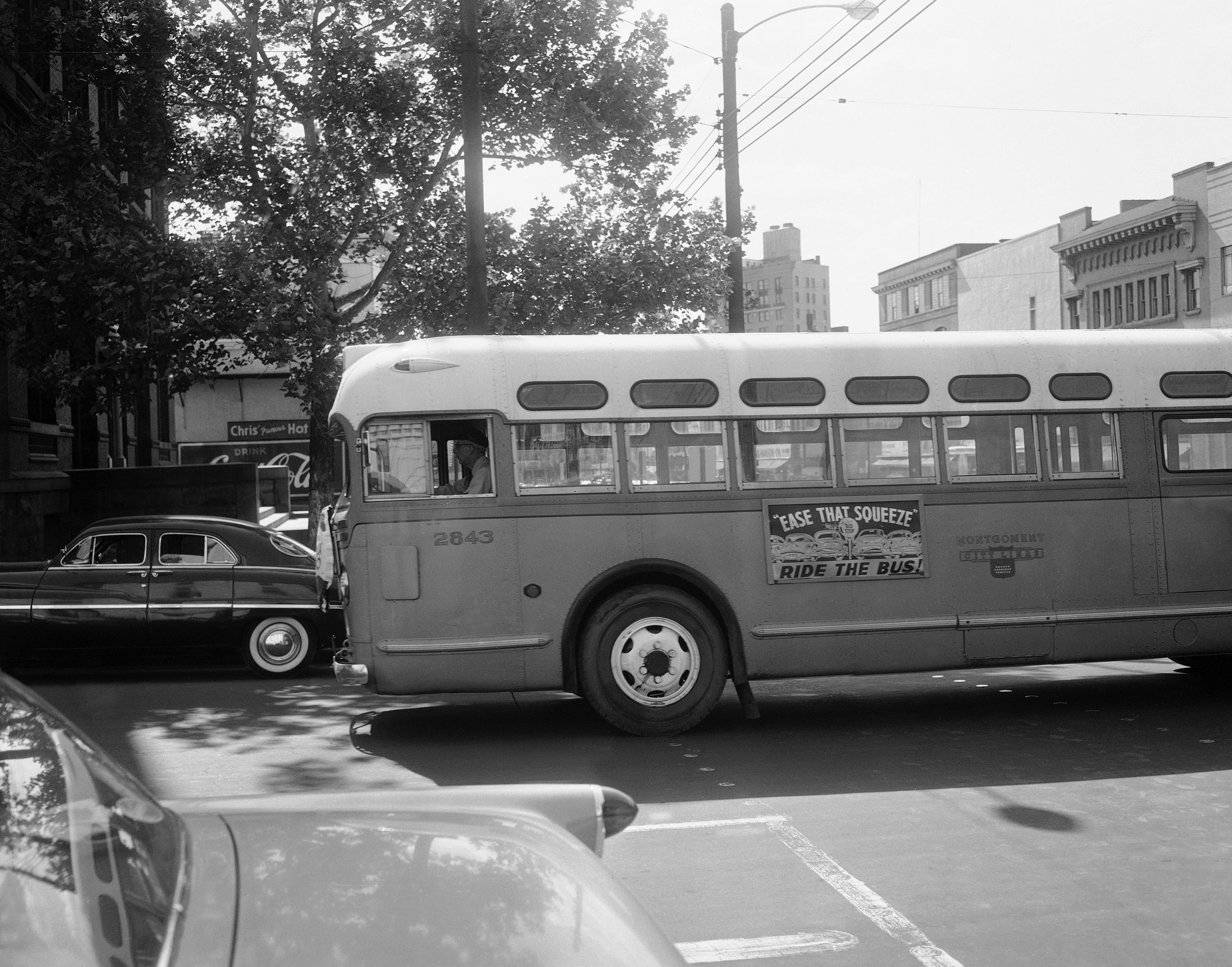 A driver guides an empty bus through downtown Montgomery, Ala., April 26, 1956.