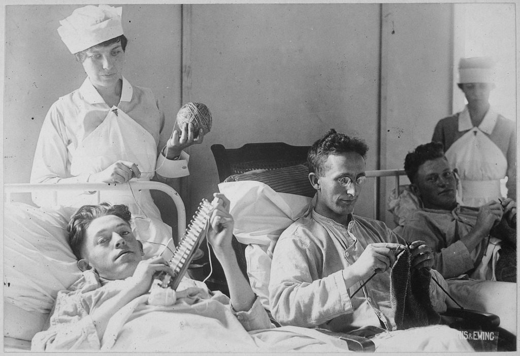 Bed-ridden soldiers knit during World War I. 