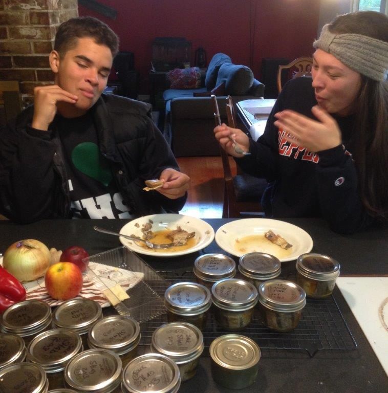 Teenagers eating canned shad.