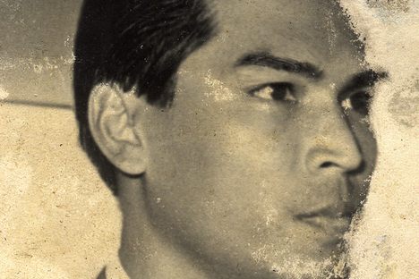 Rama's father receiving a medal from King Sihanouk, who was cut out of the photo. 