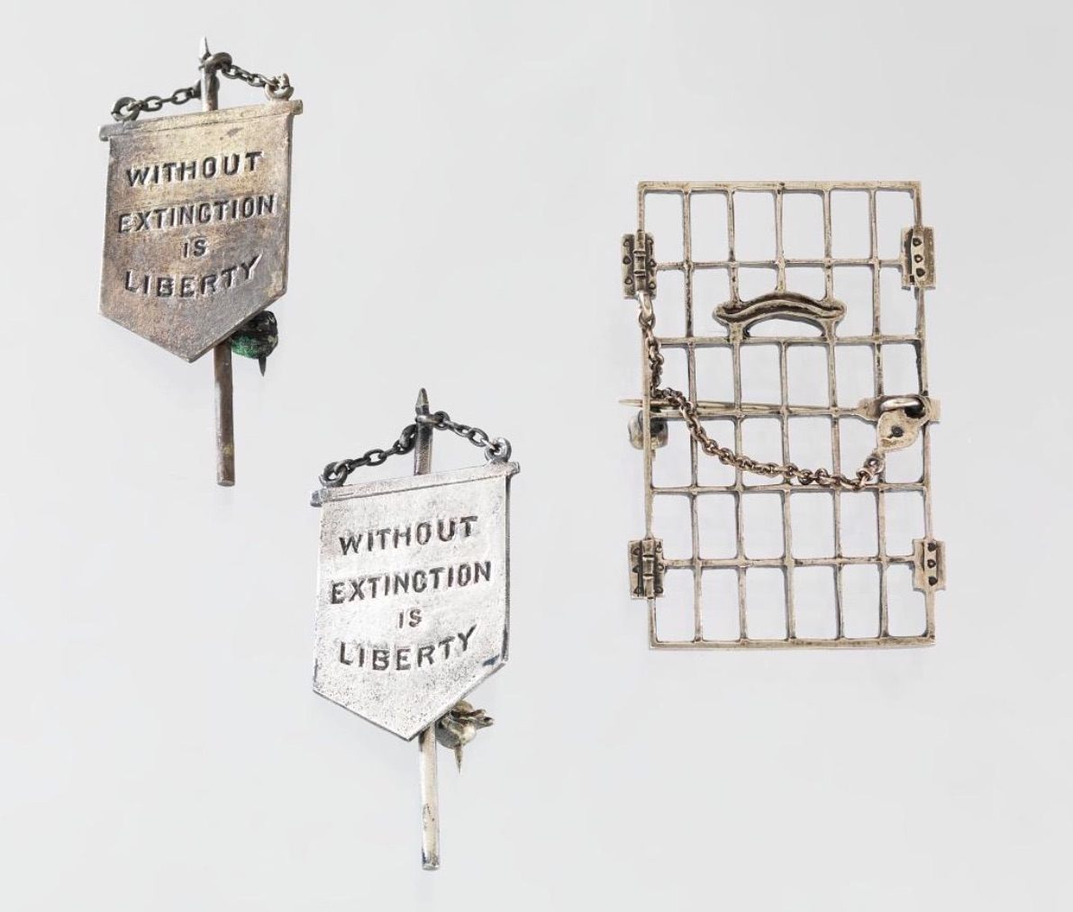Alice Paul's "Jailed for Freedom" and "Silent Sentinel" pins. 